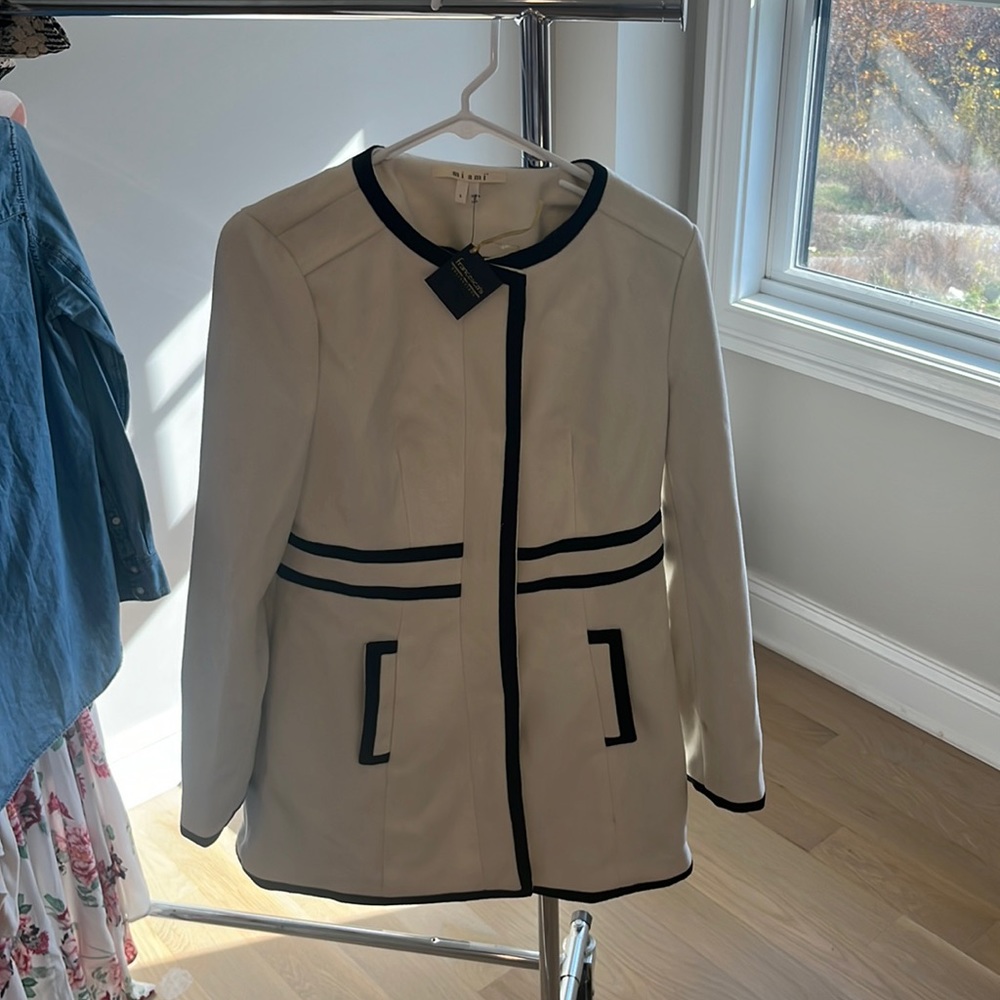 White coat with black trim